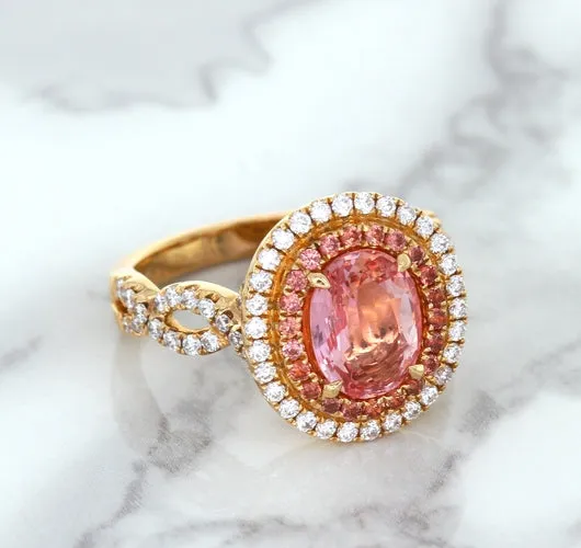 2.07ct. Oval Padparadscha Ring with Sapphire and Diamond Halo in 18K Rose Gold