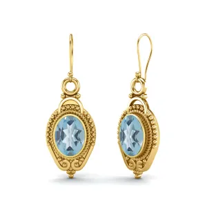 9k Yellow Gold 7x5mm Oval Blue Topaz Dangle Earrings For Women