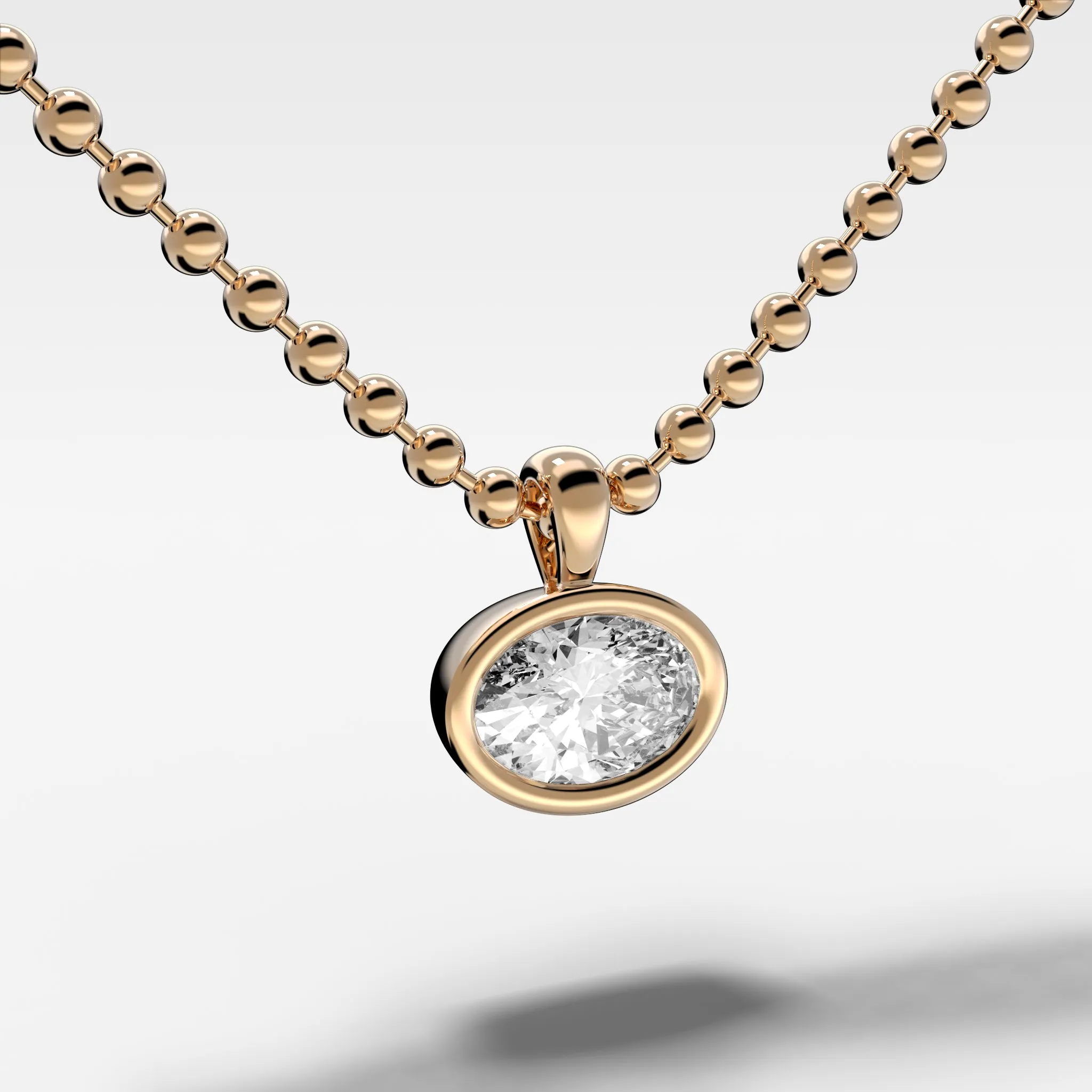 Bezel Set Pendant Beaded Necklace with East West Oval Cut Diamond