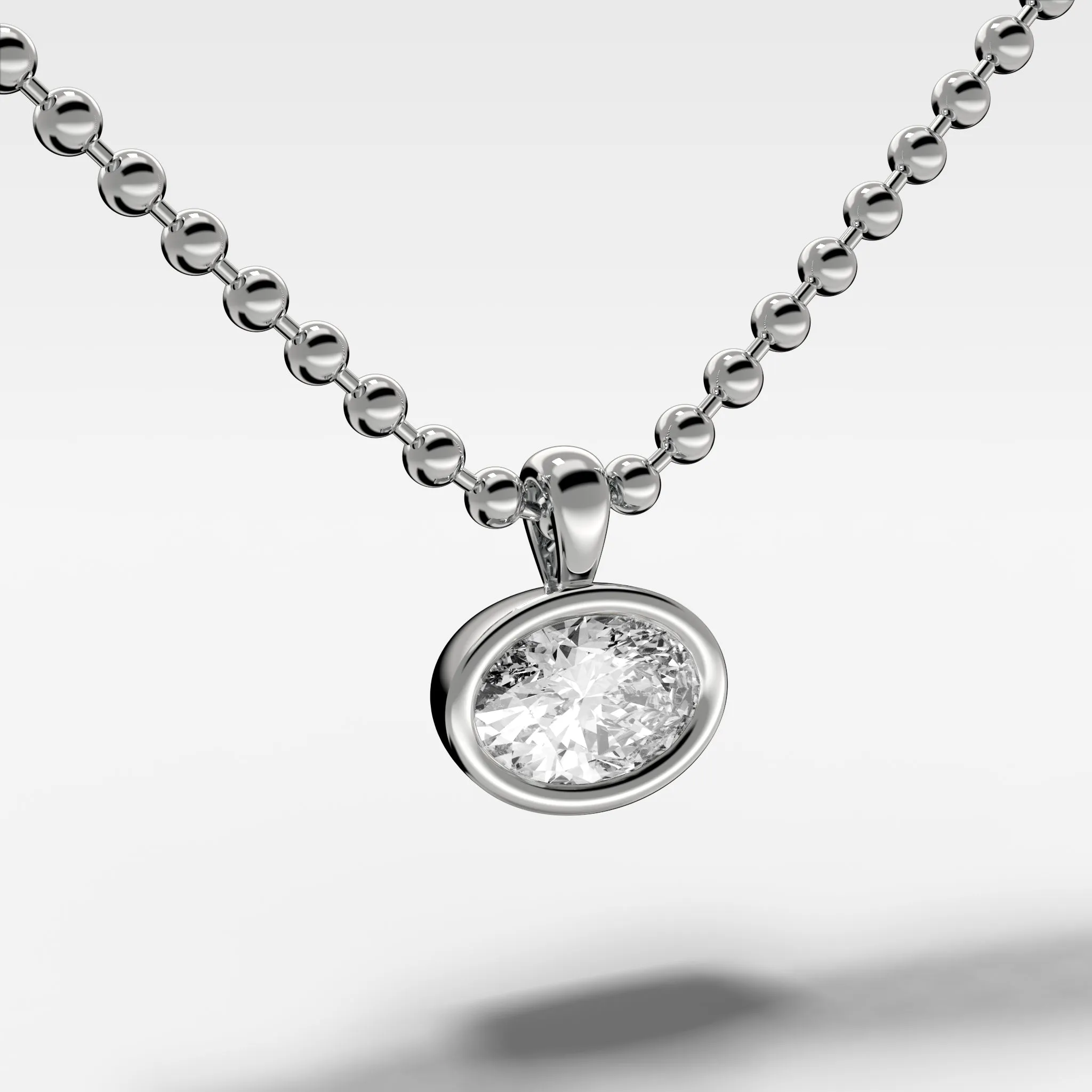 Bezel Set Pendant Beaded Necklace with East West Oval Cut Diamond