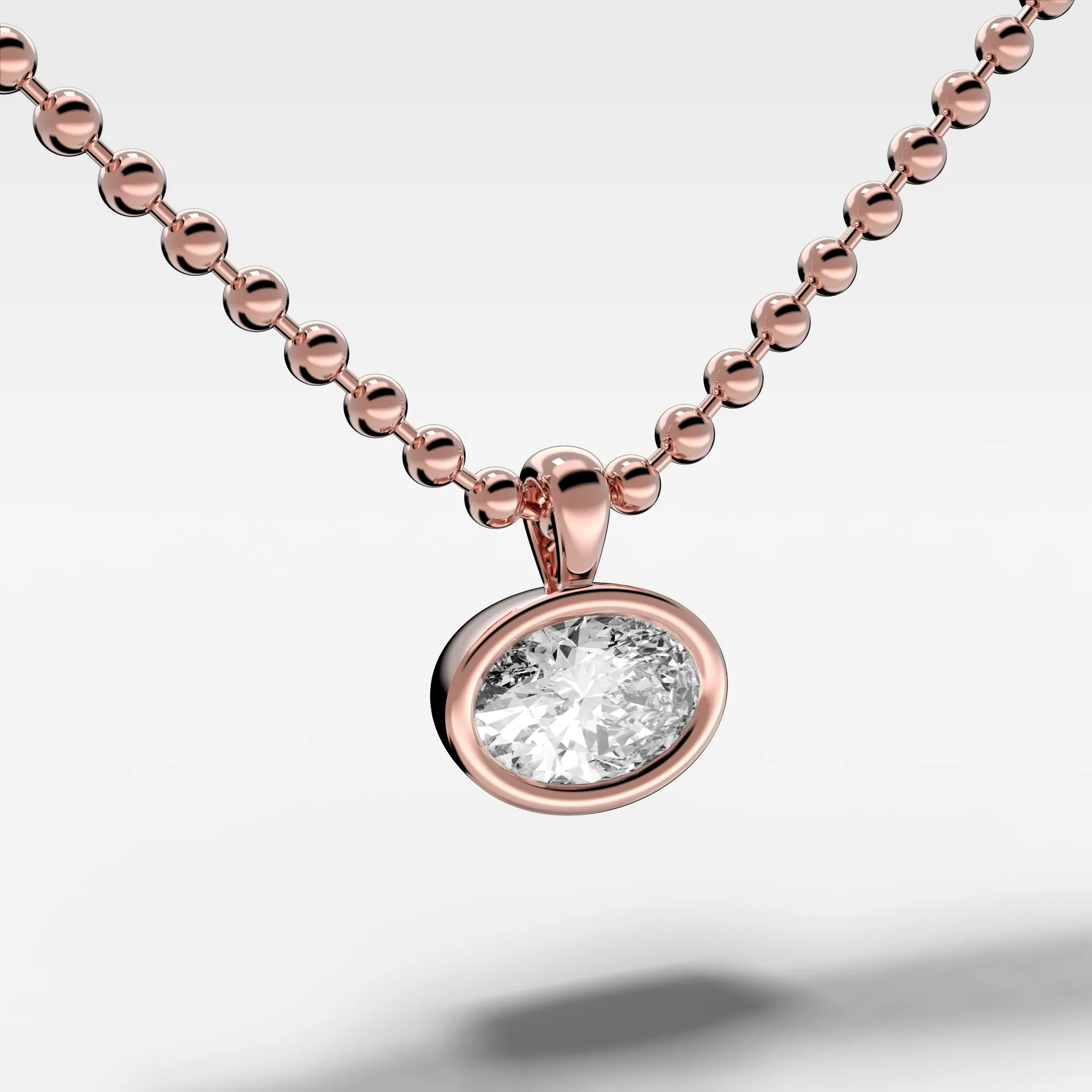Bezel Set Pendant Beaded Necklace with East West Oval Cut Diamond