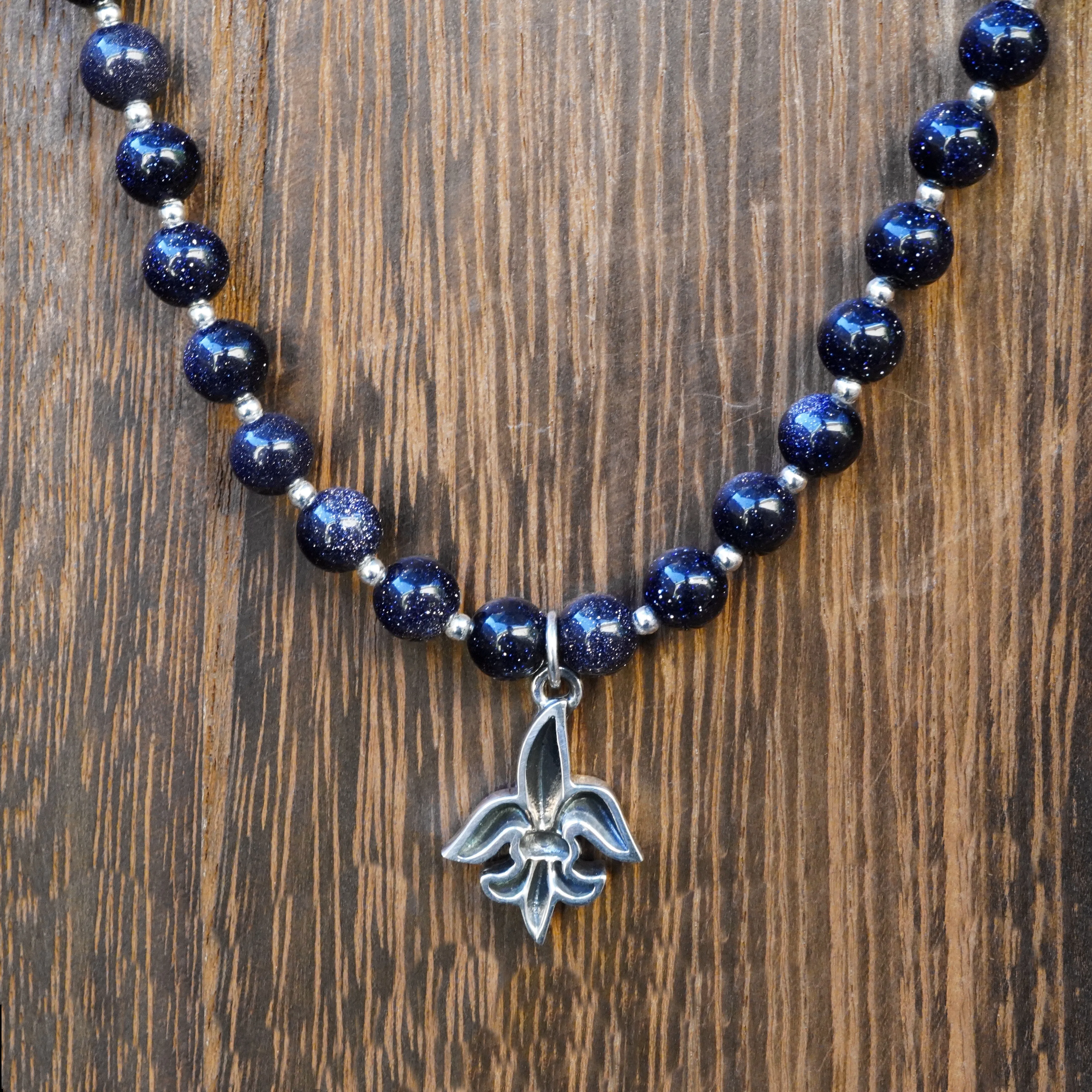 Tim & Mabel Fleur de Lis Blue Goldstone Necklace